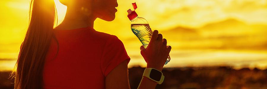 women drinking water after a light workout on a recovery day