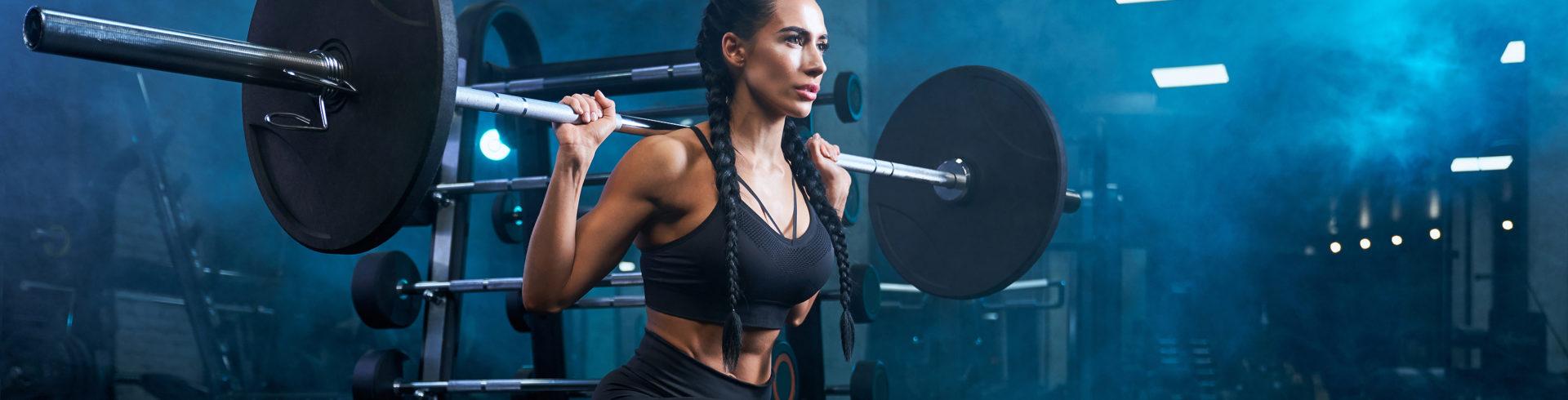 Woman doing a back barbell squat