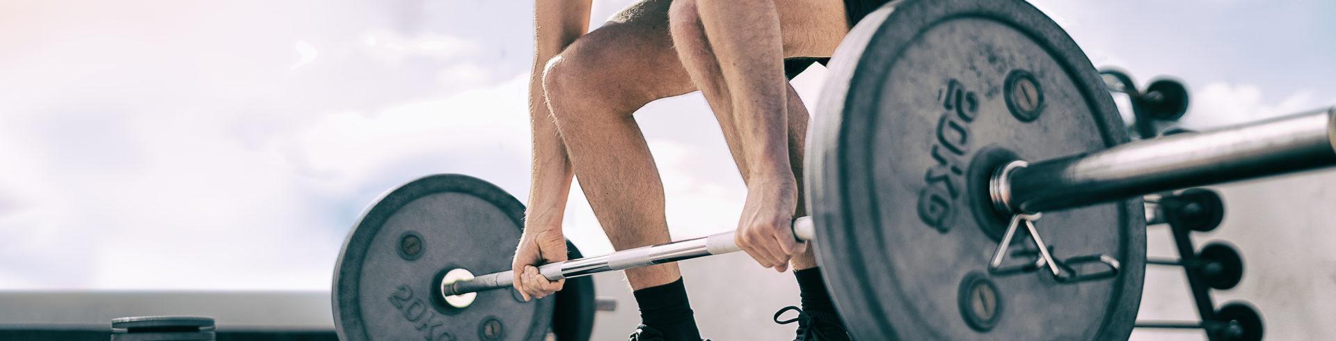 Man performing a barbell deadlift