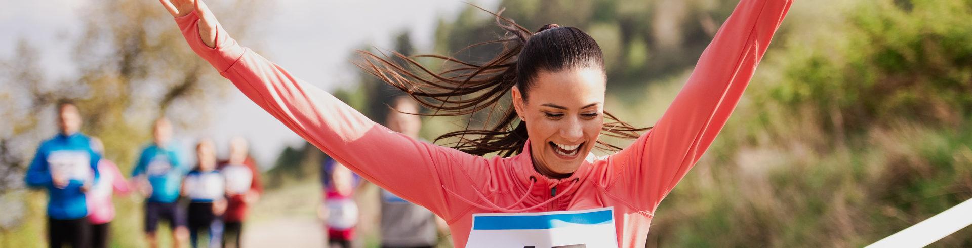 athletic person celebrating after a race