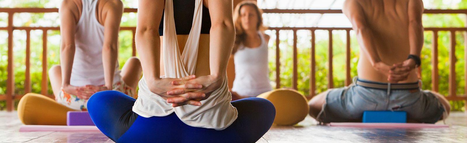 women and men doing back stretches for back pain relief