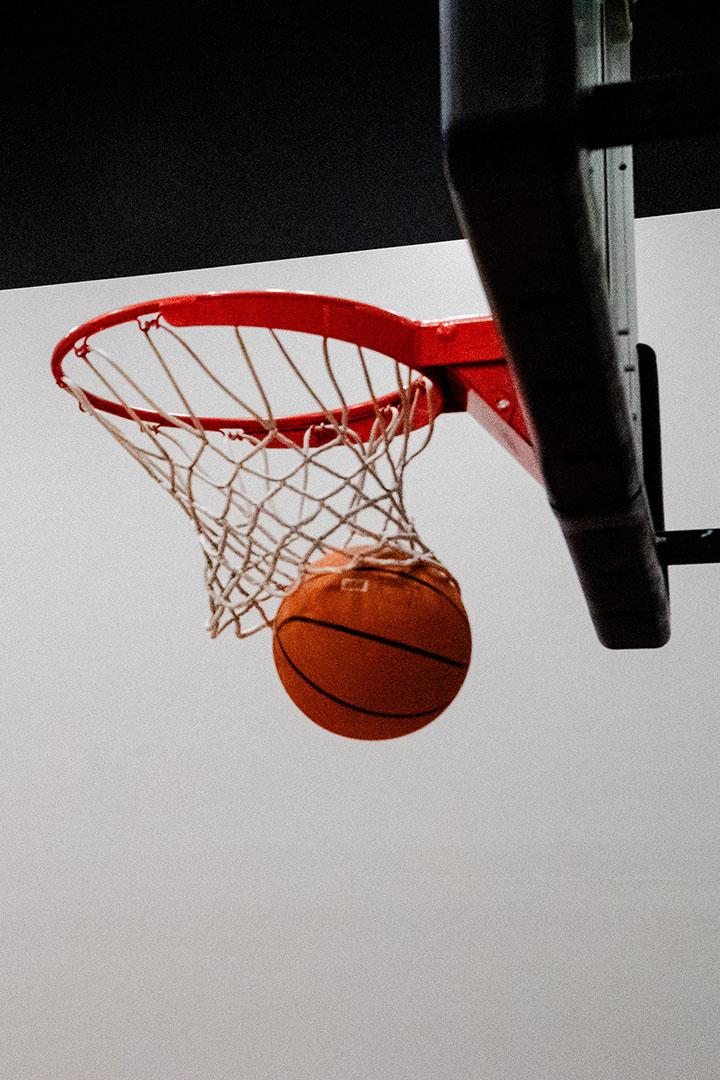 Basketball going through a hoop