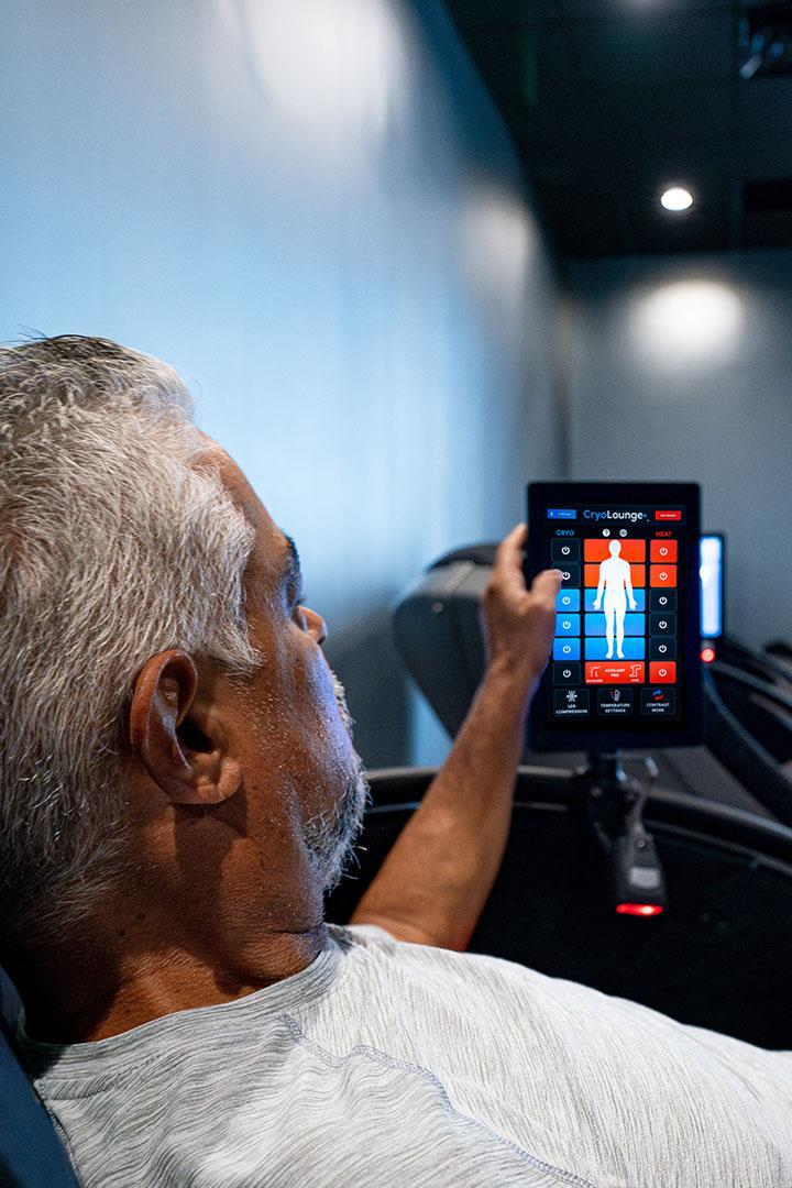 eos gym member adjusting the settings on a cryo tank